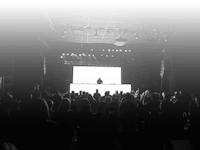 a black and white photo of a crowd at a concert